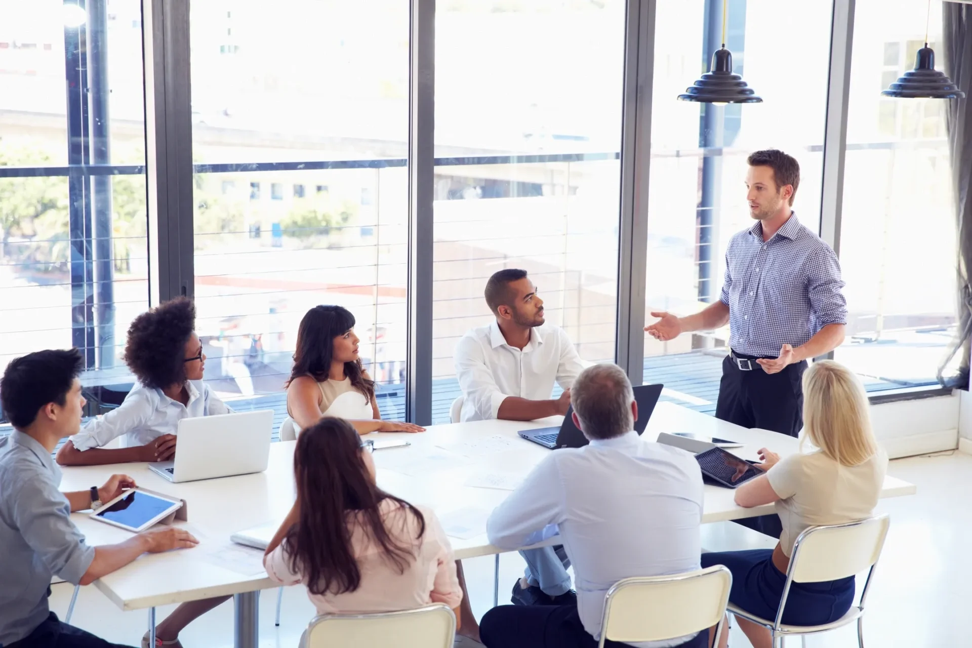 Team meeting with presenter in modern conference room
